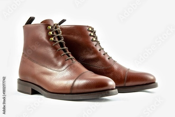 Obraz Classic light brown leather shoes in a white background. 