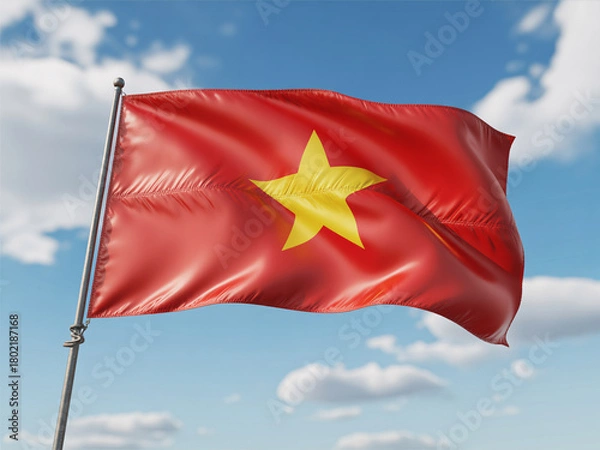 Fototapeta Vibrant Vietnamese flag proudly waving against a bright blue sky with fluffy white clouds, symbolizing national pride and heritage.