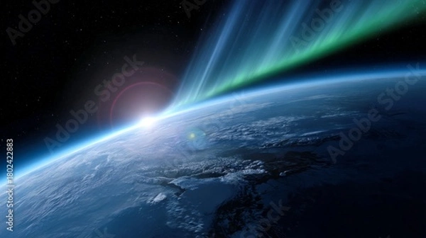 Fototapeta A stunning view of Earth from space. The sun rises on the horizon, casting beautiful light. Colorful auroras cascade over the planet. Perfect for nature and science topics. AI