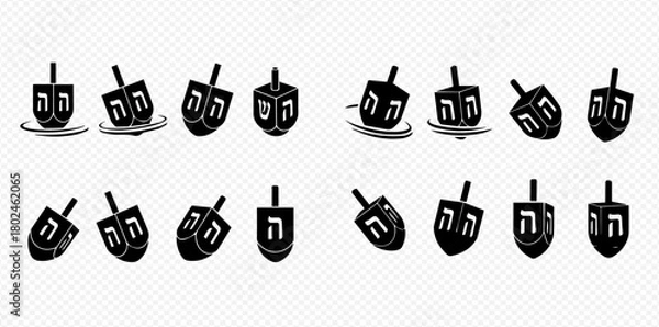 Fototapeta A collection of dreidels, traditional spinning tops used during the Jewish holiday of Hanukkah, in various orientations.