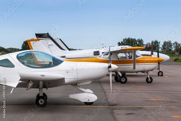 Obraz Small private airplanes parked at the airfield