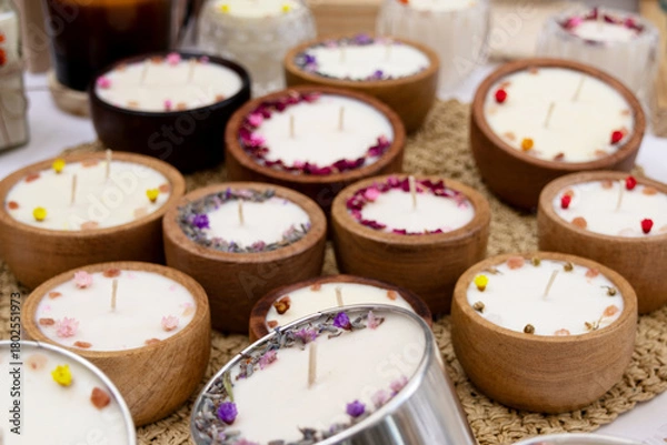 Fototapeta Blurred image of several scented candles together