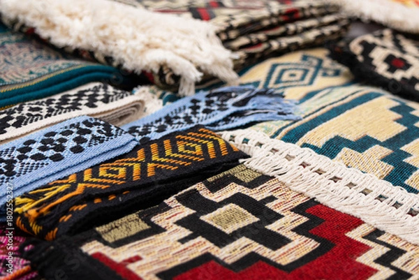 Obraz Close-up image showing various woolen garments with different pattern designs.