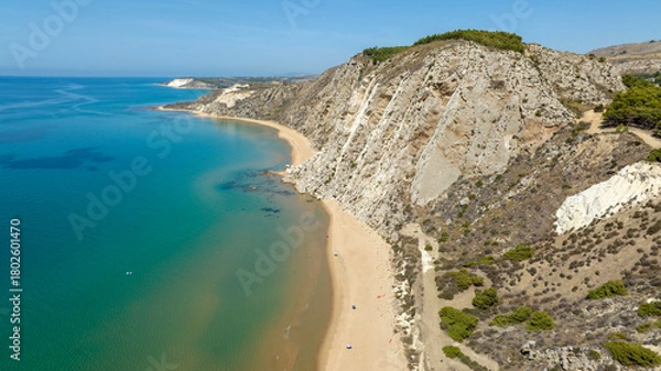 Fototapeta Aerial view of the beach and coastline of Siculiana Marina, in province of Agrigento, Sicily, Italy. It is a long sandy coast overlooking the Mediterranean Sea, whose waters are blue and turquoise.