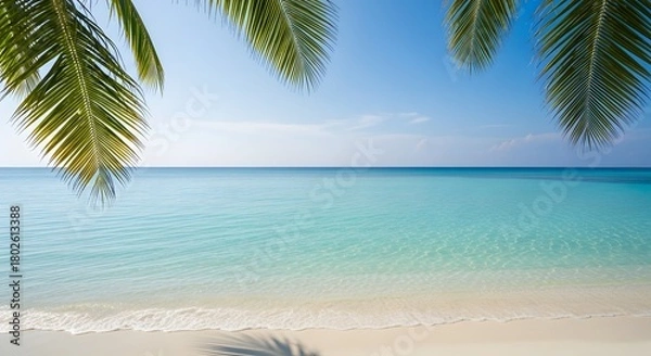Obraz Tropical beach with turquoise water, palm leaves partially framing the shot