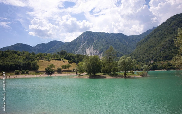 Obraz Lake Tenno in Italy has a small island and is located in a beautiful mountain landscape.