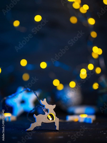 Fototapeta Christmas background with copy space. Garland with a deer.