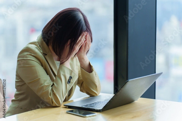 Obraz 頭を抱えるビジネスパーソン