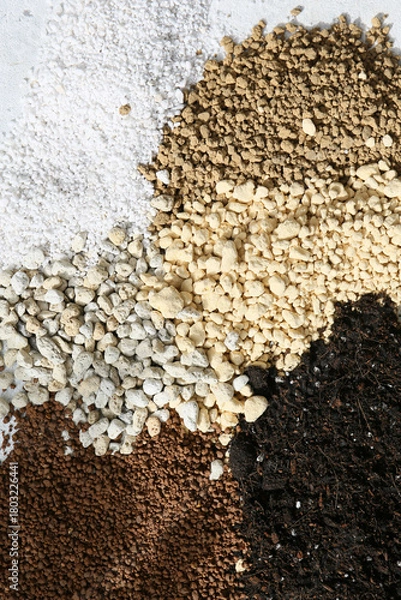 Fototapeta making a handamde soil mix special for a cactus arrangement pot