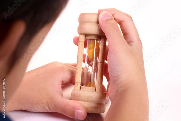 Obraz 砂時計を見つめる子ども