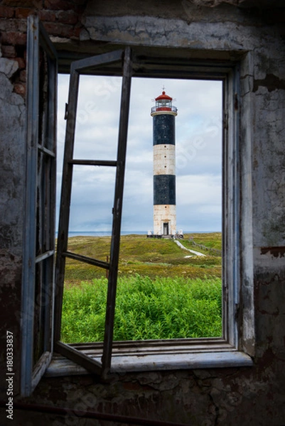 Obraz View of the lighthouse through the windows of the old house