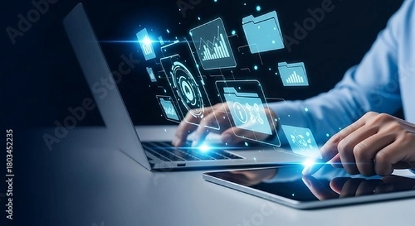 Fototapeta Businessman using laptop and tablet analyzing sales data and economic growth graph on virtual interface, business strategy development concept