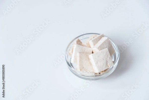 Fototapeta Sagun bakar is a traditional cake from West Sumatera, Indonesia, made from sago flour and grated coconut