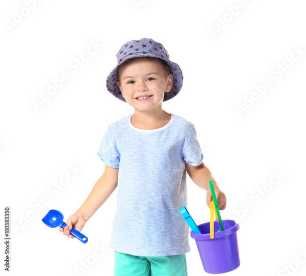 Obraz Cute little boy with beach toys on white background