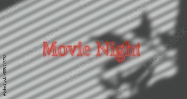 Fototapeta Projecting red text Movie Night at home, blinds casting diagonal shadows, blurred silhouette right