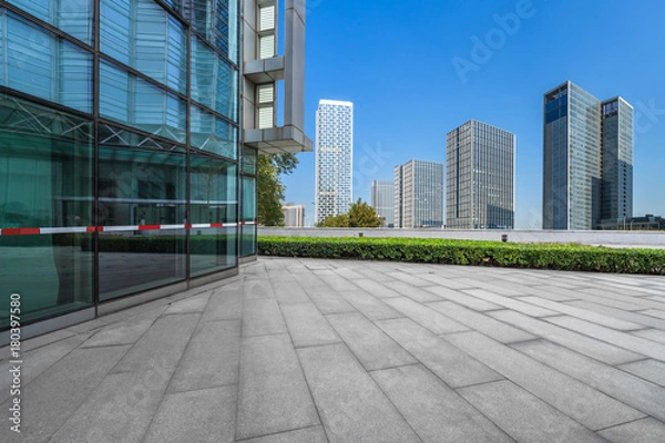 Fototapeta modern buildings and empty pavement in china..
