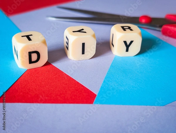 Obraz diy do it yourself concept on geometric paper background with craft scissors