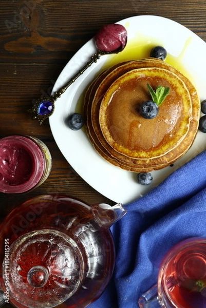Fototapeta Tasty homemade pancakes with honey and berries