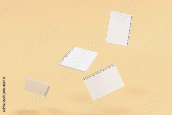 Fototapeta Four notebooks with spiral bound on orange background