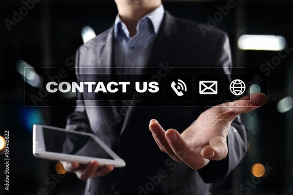 Fototapeta Contact us button and text on virtual screen. Business and technology concept.