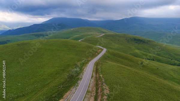 Obraz The car is driving along a road in the Caucasus Mountains to the Dzhila-Su Valley
