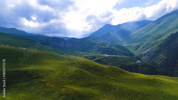 Fototapeta a drone flies over a campsite in a mountain gorge in the Jily-Su valley in the Caucasus, at the foot of Elbrus