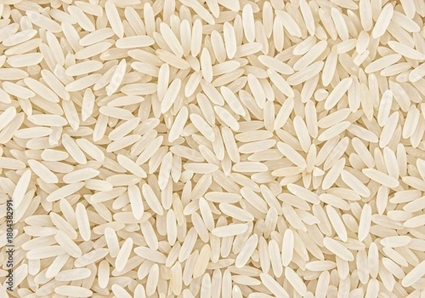 Fototapeta Close up abstract texture of uncooked white rice grains