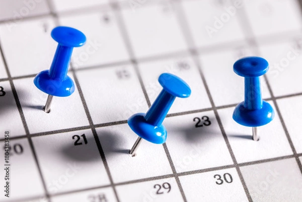 Obraz Calendar appointment blue thumbtacks in various dates on calendar diary