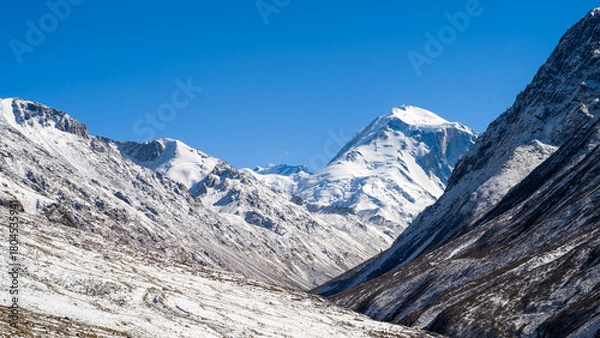 Obraz snow-capped mountain peaks. highlands, cliffs