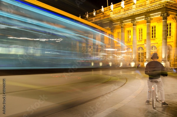 Fototapeta Nocturnal passage of a tramway in front of the Grand Theatre of Bordeaux	