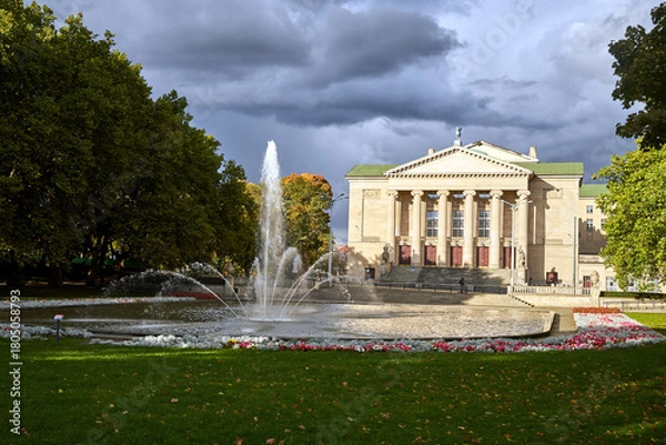 Obraz fountain, street and facade of historic opera building in Poznan