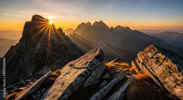 Obraz Dramatic sunburst over stunning mountain peaks at sunrise, a vista of adventure, freedom, and breathtaking natural beauty inspiring exploration