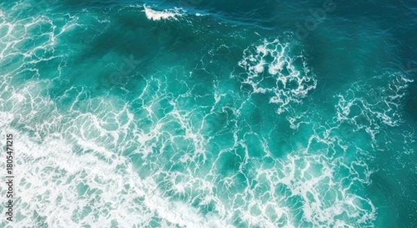 Obraz Overhead shot of churning ocean waves in varying shades of teal and turquoise, creating a textured and dynamic surface