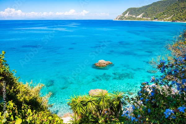 Fototapeta View of rocks in crystal clear turquoise sea on Agios Nikitas beach, Lefkada island, Greece