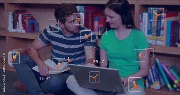 Obraz Studying two students in striped and green shirts in library, using laptop and notes with overlay