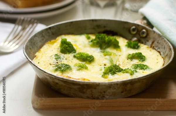 Fototapeta Omelette with broccoli and cheese served with bread toasts and lemonade.