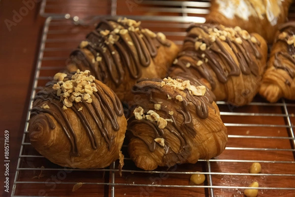 Obraz Close up photo of tray of golden brown, flaky and look freshly baked croissants in bakery.
