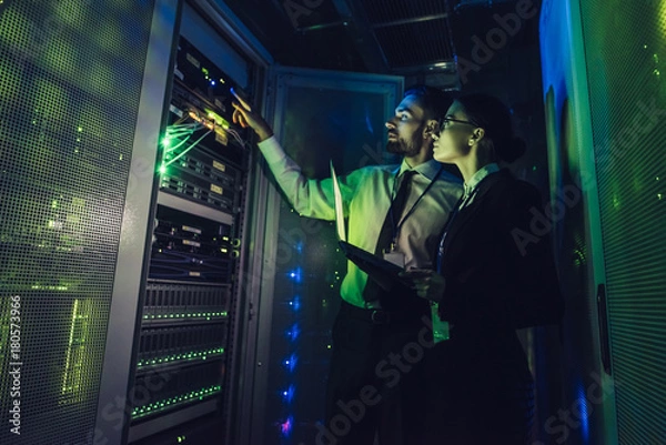 Obraz Man and woman in data centre