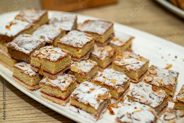 Fototapeta Almond raspberry dissert squares on a party tray