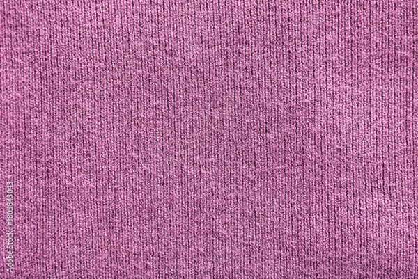 Fototapeta Close-up shot of a purple ribbed textile, showcasing the vertical texture and soft material.