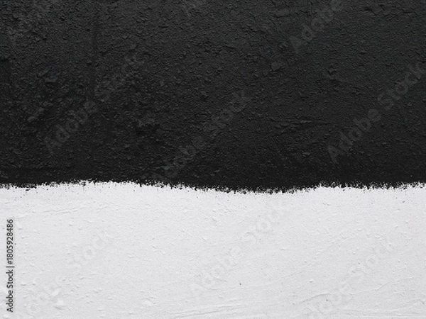 Obraz Abstract vertical texture background split into black asphalt and white painted concrete. High contrast surface.