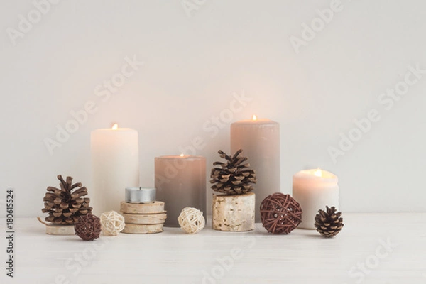 Fototapeta Christmas candles, wood slice decorations, pine cone on white background