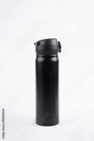 Fototapeta A black drinking bottle is placed on a white background, creating a clean and striking contrast