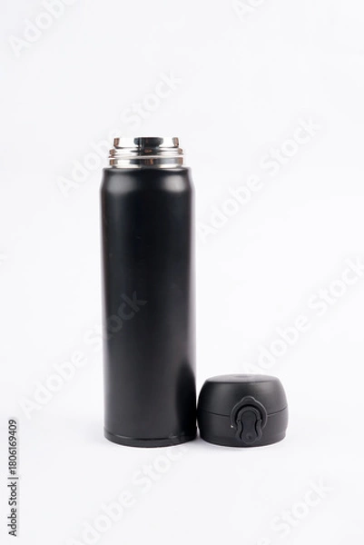 Fototapeta The bright white backdrop highlights the bottle’s shape and modern design