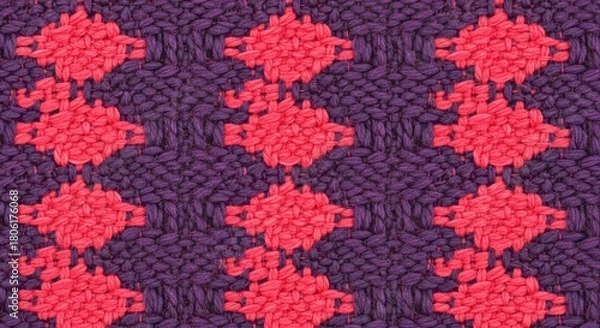 Obraz Closeup of a woven fabric with a diamond pattern in red and purple, creating a textured and visually appealing textile design