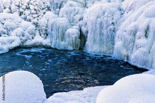 Obraz Frozen waterfall by a pond a cold winter day