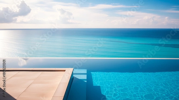Obraz Stunning infinity edge swimming pool overlooking the ocean A lux