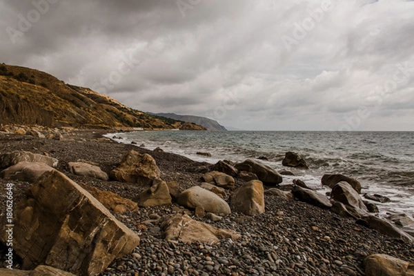 Fototapeta Rocky sea beach view with moody cloudy sky. Crimea russia horizontal iew