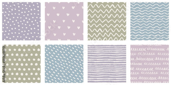 Fototapeta Hand-drawn seamless backgrounds collection with brush-painted waves, zigzags, striped, polka dot, mottled and hearts patterns. Vintage texture with white and purple blue pink green muted faded colors.