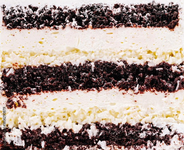 Fototapeta Chocolate and cream layered dessert served on a white plate at a gathering